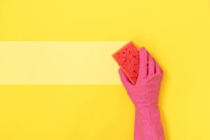 Woman cleaning walls