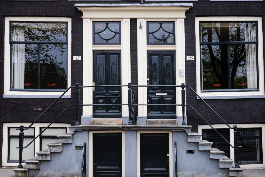 black houses with white trim and black front doors