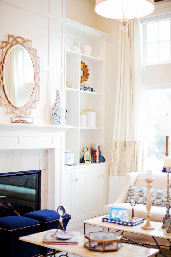 built in white bookshelves fireplace