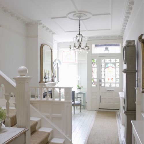 ornate hallway decor with white walls