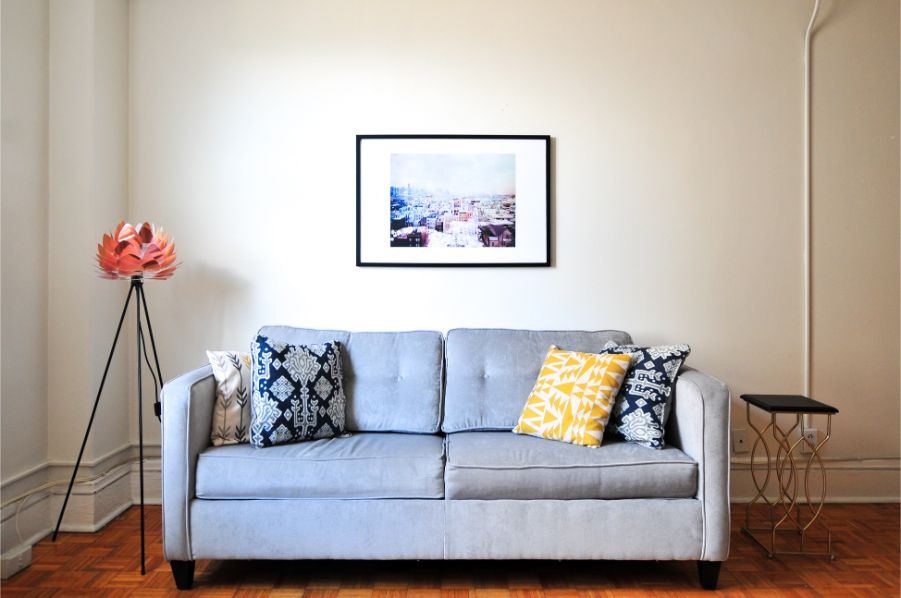 pale yellow walls blue couch