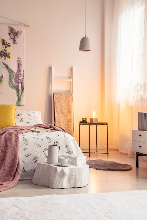 pink and beige bedroom with candle