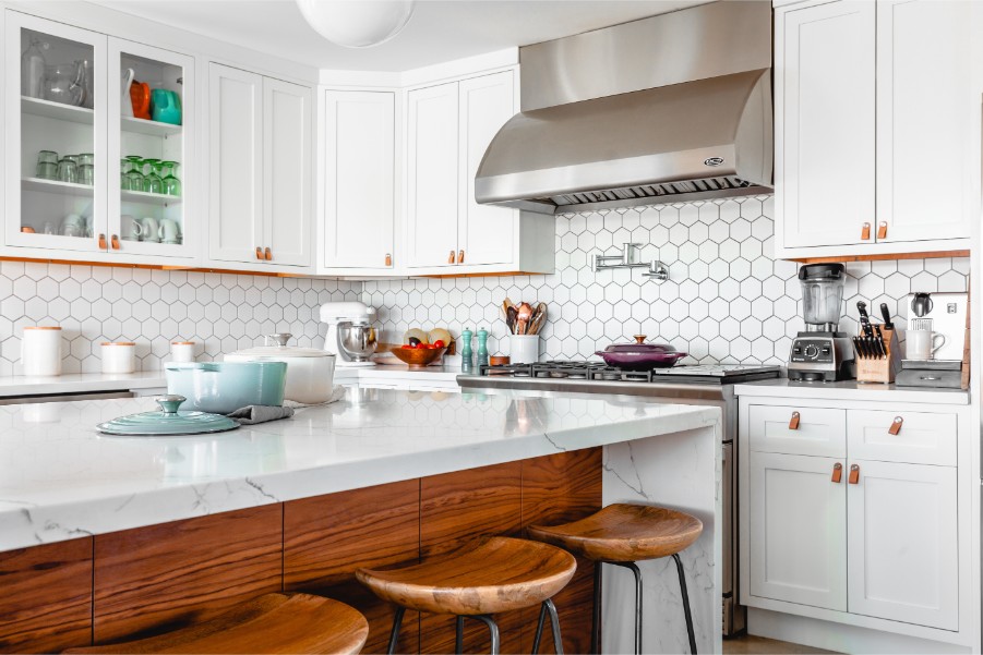 white kitchen with stainless steel hood