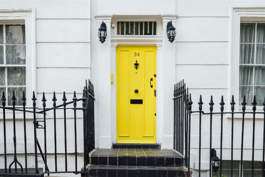 yellow front door white exterior
